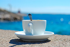 Coffee cup by the ocean